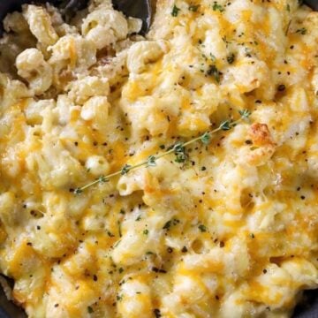 Baked Mac & Cheese topped with 5 cheeses and fresh herbs.