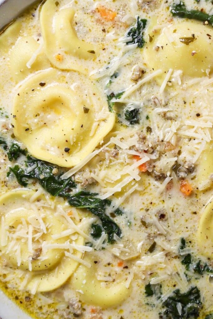 Creamy Sausage, Kale, & Ravioli Soup - Must Love Garlic