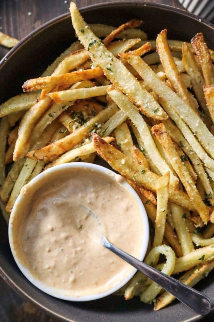 Garlic & Parmesan Pommes Frites with Cajun Sauce in a Grey Plate