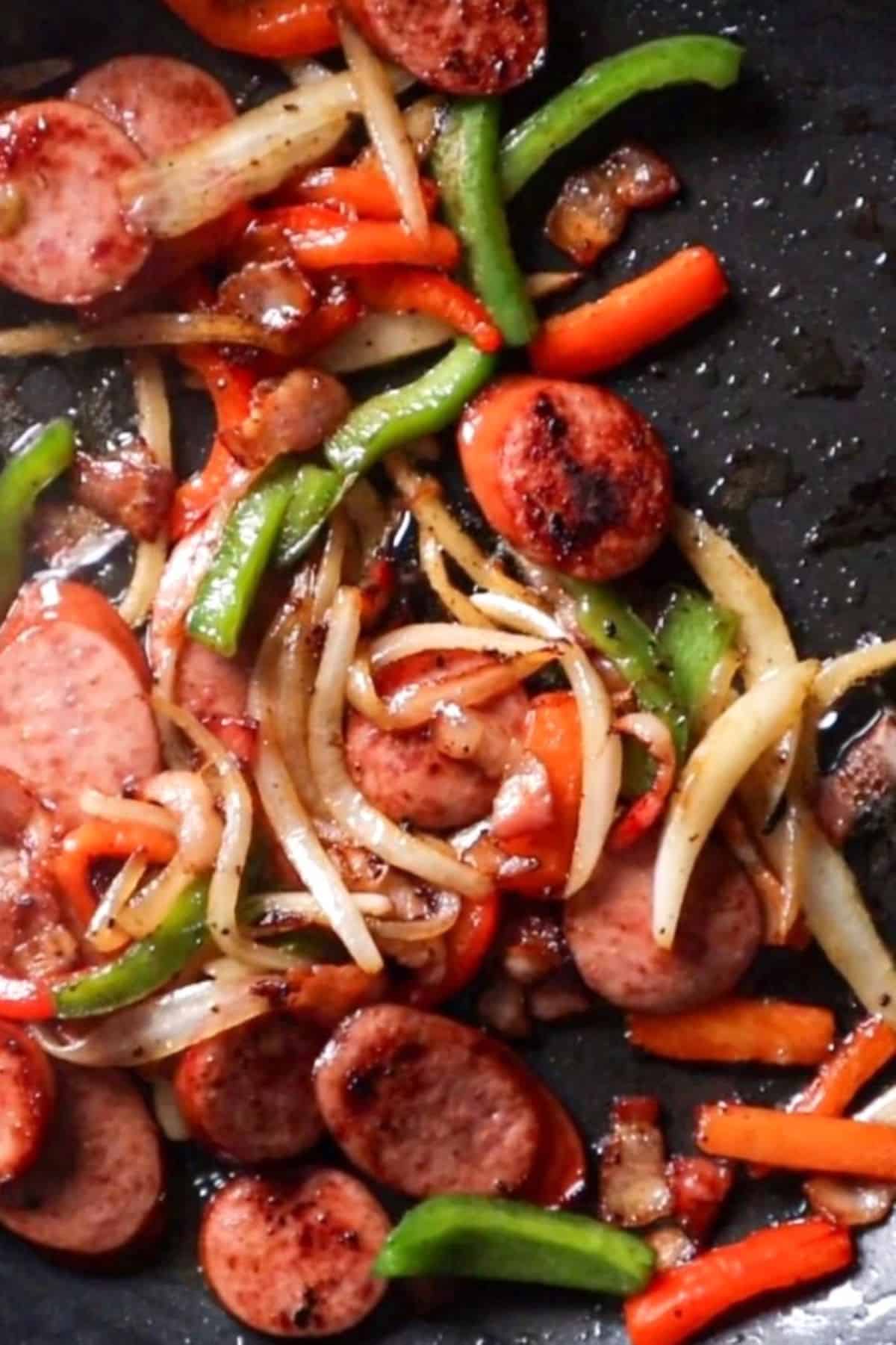 sautted sausage onions and peppers in pan