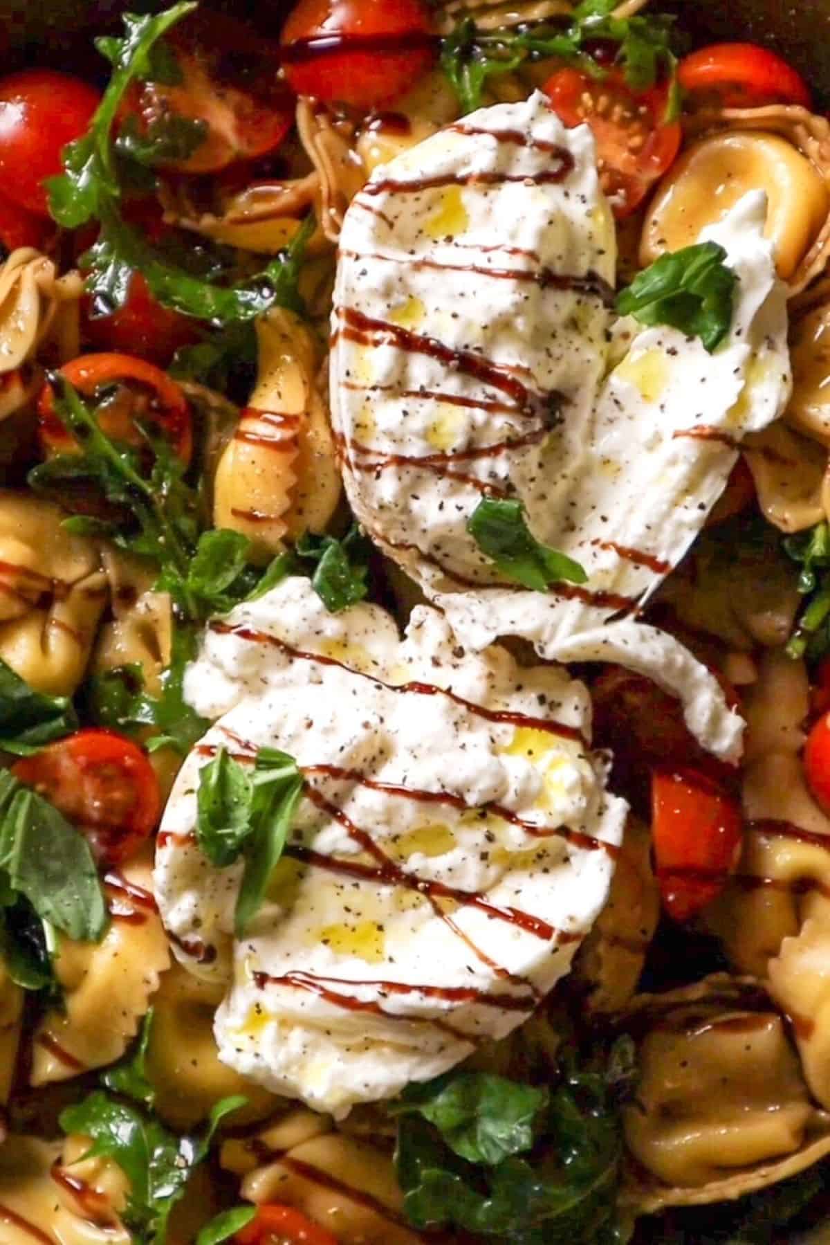 caprese tortellini arugula burrata salad with balsamic glaze
