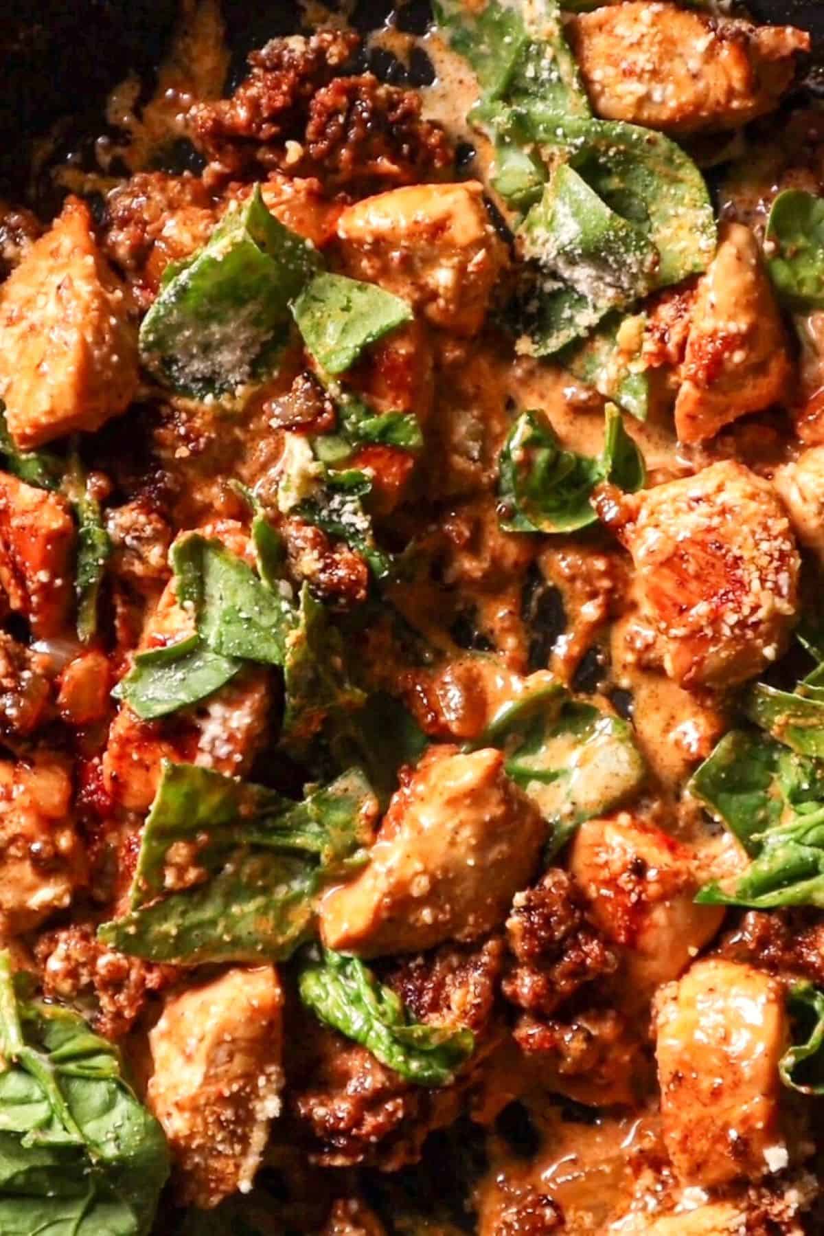 chicken chorizo pasta ingredients in pan