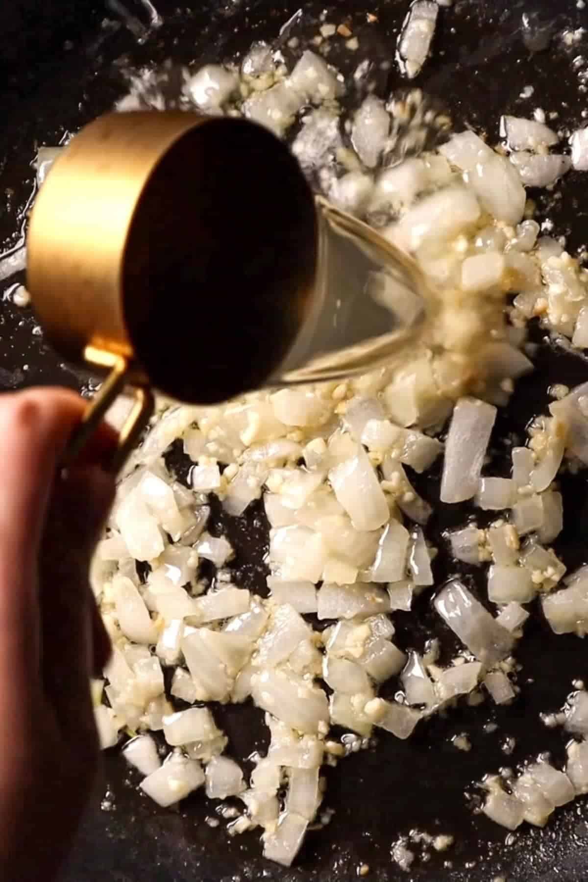 onions and garlic with broth