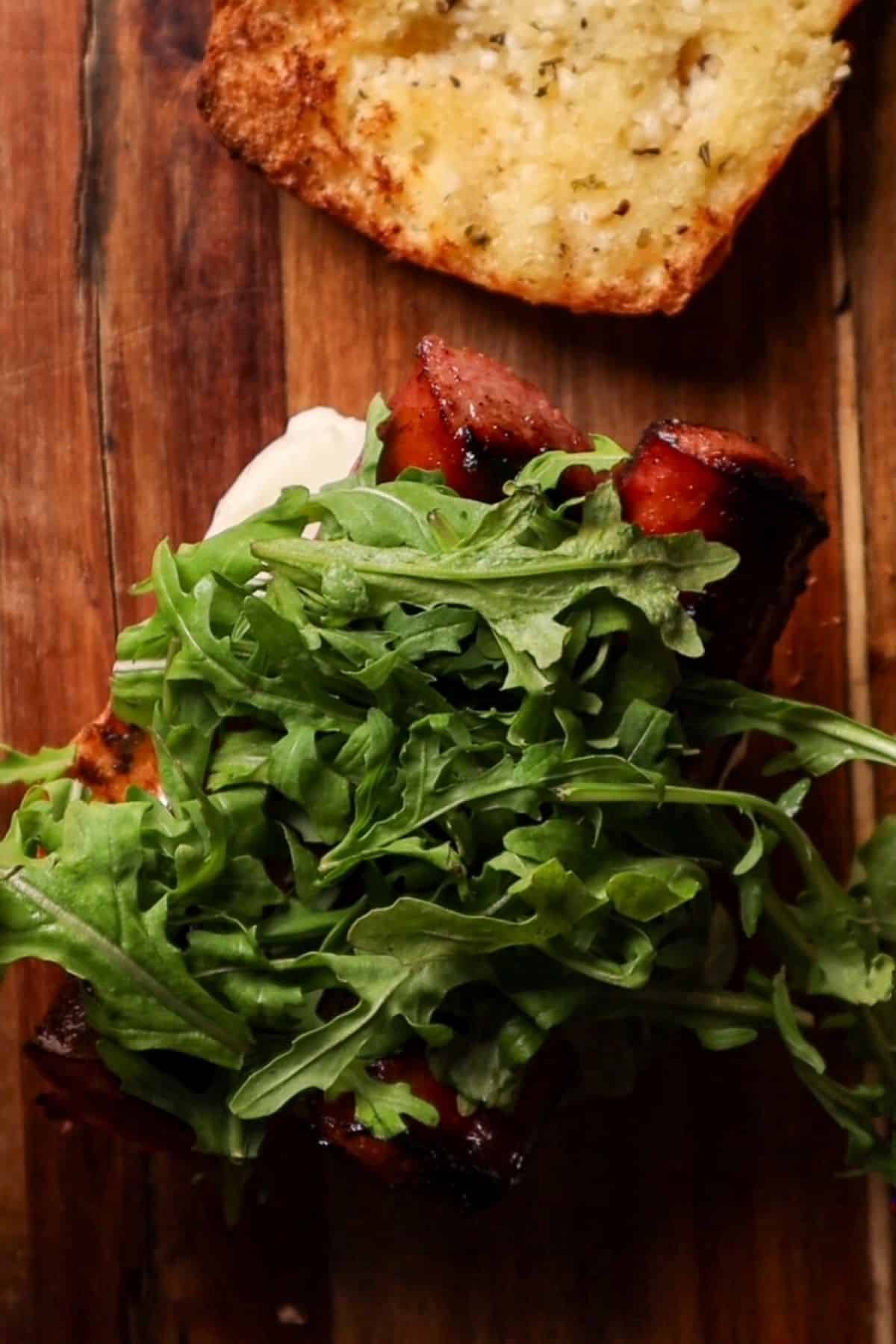smoked sausage with mozzarella and arugula
