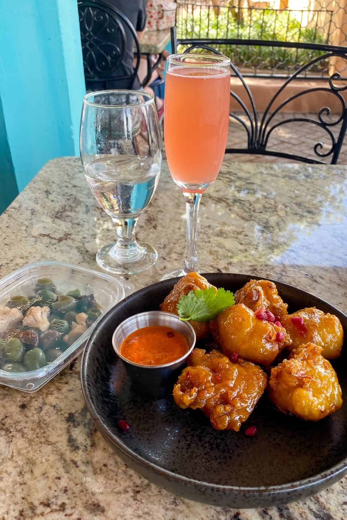 spice road table epcot pomagranate mimosa olives and cripsy cauliflower