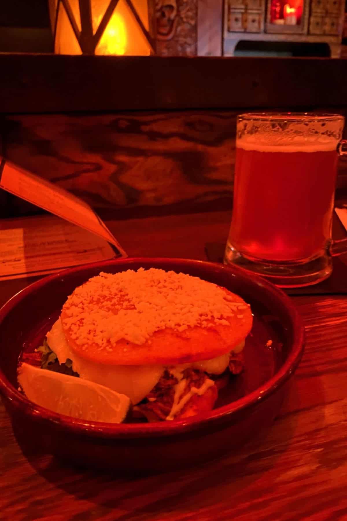 the beak and barrel griddled corn cake with chicken and pint of beer