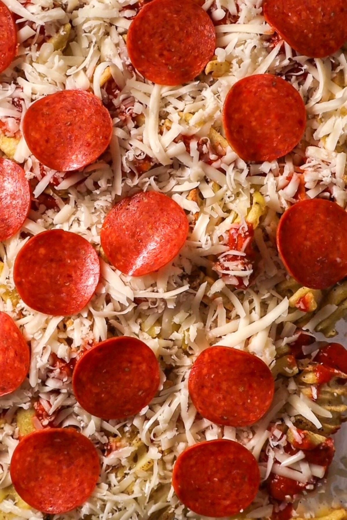 fries with pizza sauce cheese and pepperoni